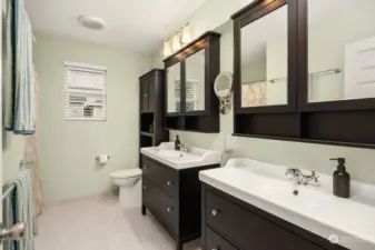 Main bath upstairs shared by bedrooms 2 and 3 - updated and with dual vanities.