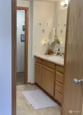 bathroom opens to hallway and mudroom