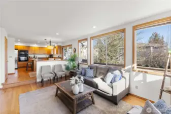 Cozy family room with fireplace is just off the kitchen and dining area.