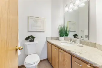 Main floor 1/2 bath, just off mudroom entry from garage.