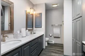 Upstairs primary bath has double vanity & big shower.