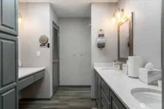 Upstairs primary bath also has makeup area