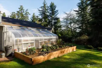 Outside view of the solarium and raised garden bed