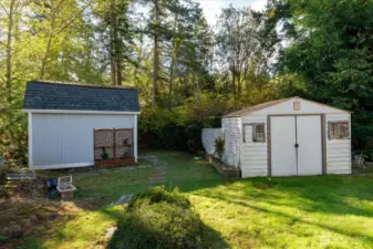 Garden/storage sheds tucked away in back yard