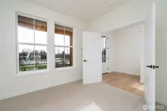 Main level den/office - Pics are of a different 2389 Kyler plan home. Features and colors may differ.