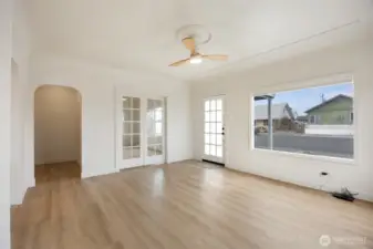 Sun filled frontroom has custom shades that open both top and bottom to control the abundance of light.