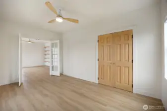 Double french doors open up to the upstairs bedroom.