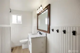 Updated upstairs remolded bathroom with marble vanity.