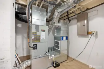Furnace room has plenty of space to store extras.