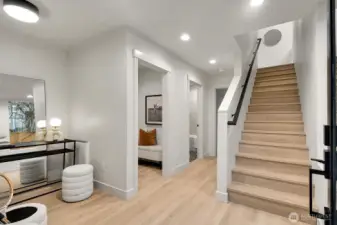Light filled entry way leads up to main floor living