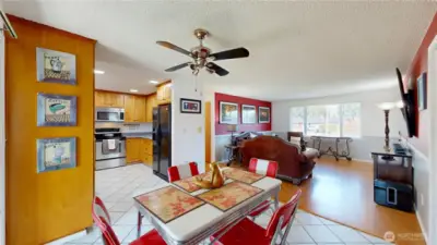 Open-concept kitchen, dining, and living area offers a bright, inviting layout with great flow for everyday living and entertaining.