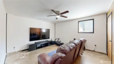 Family room offers flexible space for a media room, game room, home gym, or office.