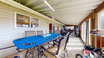 Sunroom offers a spacious, versatile area for outdoor dining, hobbies, storage, or year-round entertaining.