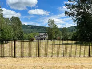 Property fenced on three sides. Open facing river bank only.