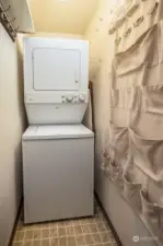 Washer and dryer in unit and has extra space for storage, or cleaning items.