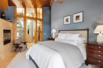 Primary suite with ensuite bathroom and gas fireplace