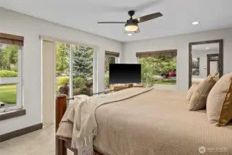 Primary bedroom with slider to the park like yard.