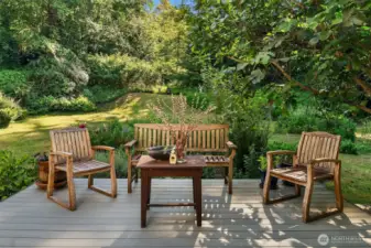Inviting deck off the dining area. What a lovely spot for al fresco meals, surrounded by greenery and birdsong.