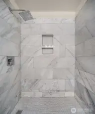 Custom marble tiled shower.