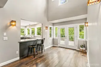 Formal dining, w/ french doors leading to massive deck.