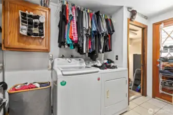 Laundry off two car garage and back door. Dor washing station to the left.