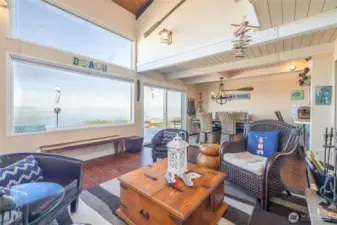 Living room w/wood fireplace & views.