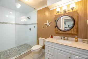 Beautifully remodeled 3/4 bathroom off recreation room/bar.