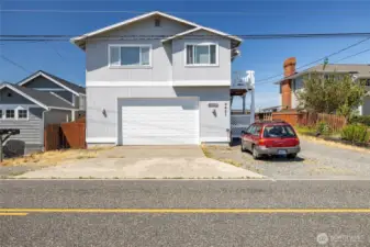 The suite is located above the 4 car garage w/ extra tall garage door.
