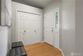 Entryway with oak hardwood floors throughout main floor.