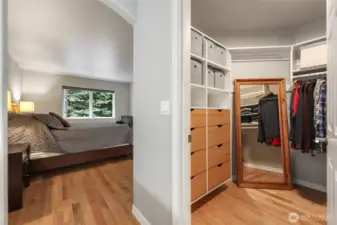 Primary bedroom walk-in closet with built-ins.