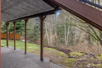 Covered patio from new deck above over looking price greenbelt with no neighbors looking in from behind.