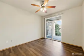 Primary bedroom with door to balcony