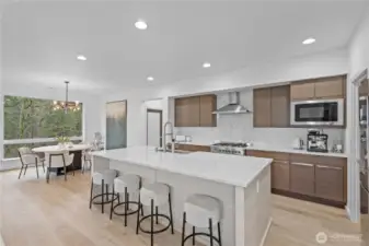 Quartz counters and top of the line new flooring throughout the kitchen