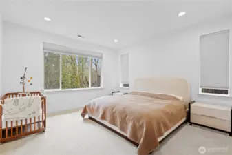 Primary suite on the back side of the house on the main floor. Look out on beautiful trees and privacy!