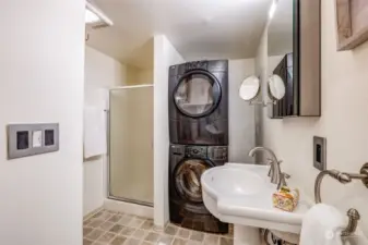 Lower level 3/4 bath with washer and dryer.