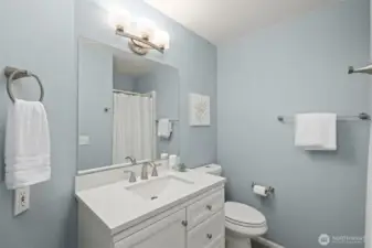 The main level guest bathroom has a walk in shower.