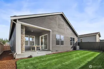 Rear yard and covered patio. Photo taken from similar model
