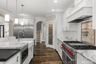 Simply stunning—this space must be seen in person to be fully appreciated. High-end appliances and luxurious slab granite countertops make this room truly stand out.