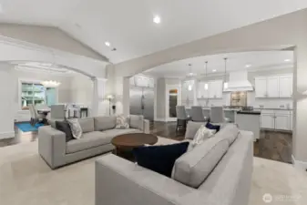 An open floor plan is light and bright with light tones of gray, griege and white.