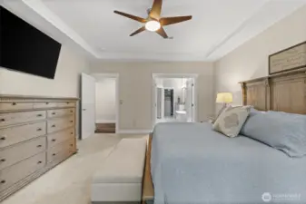 A main level primary bedroom is spacious and features an ensuite bathroom with dual closets.