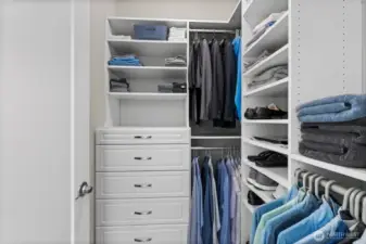 Two separate walk in closets have been customized with hard surfaces making organization of your wardrobe essentials easy.