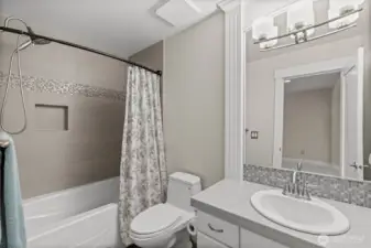 An upper level full bathroom provides the perfect place for visiting guests to have their own private space while visiting.