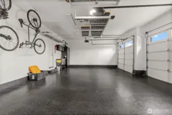 New epoxy flooring upgrades the garage with a sleek, durable surface designed for modern functionality and easy maintenance.