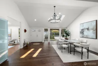 Step inside to an open layout with vaulted ceilings. The kitchen, dining, and living areas all flow together.