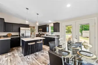 Dining and kitchen with bar and appliances