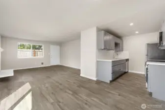 Enter in through the main entrance and be greeted by an open floor plan with fire place!