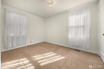 Bedroom #2 located at SE corner of home, near main bathroom.