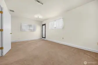 Family room located at NW corner of home with access to carport.