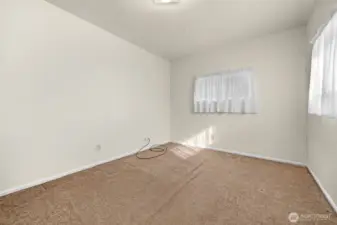 Bedroom #3 (or office) at opposite end of home from bedrooms #1 & 2, adjacent to family room.
