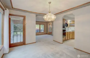 The Dining room enjoys nice flow into the kitchen, living room, and covered porch!